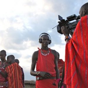 Native tribe using modern camera equipment