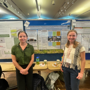 Graduate students Hope Radford and Rose Parham in front of their poster on community-led conservation in Ecuador at the 2023 Graduate Student Showcase. Radford and Parham won an International Programs Global Impact Award for their project.