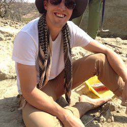Anthropology student smiling while working in the field