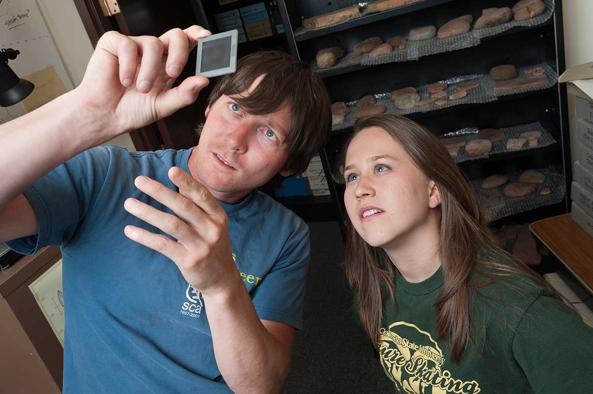 Professor working alongside a student in a lab