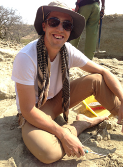 Anthropology student smiling while working in the field