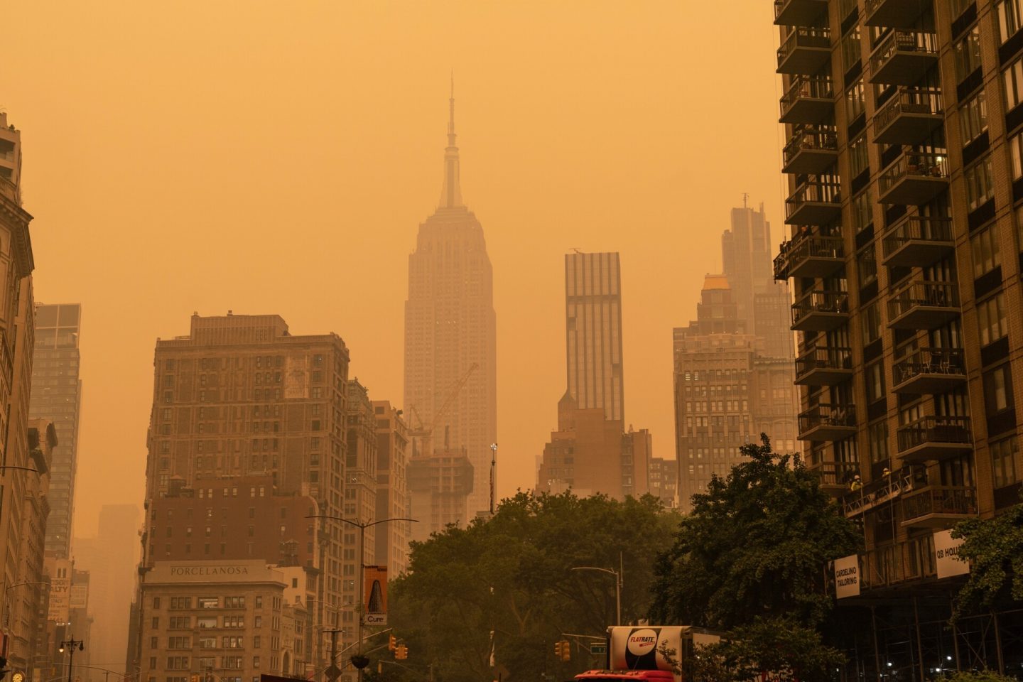 Hazy view of New York City and Empire State Building from June 2023