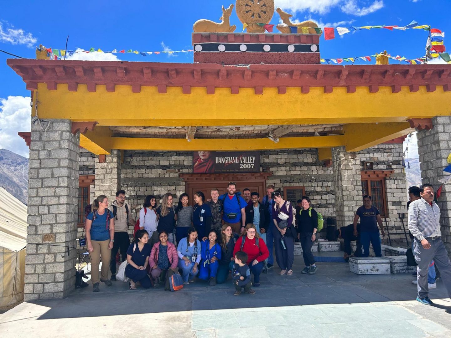 Student group standing under pagoda